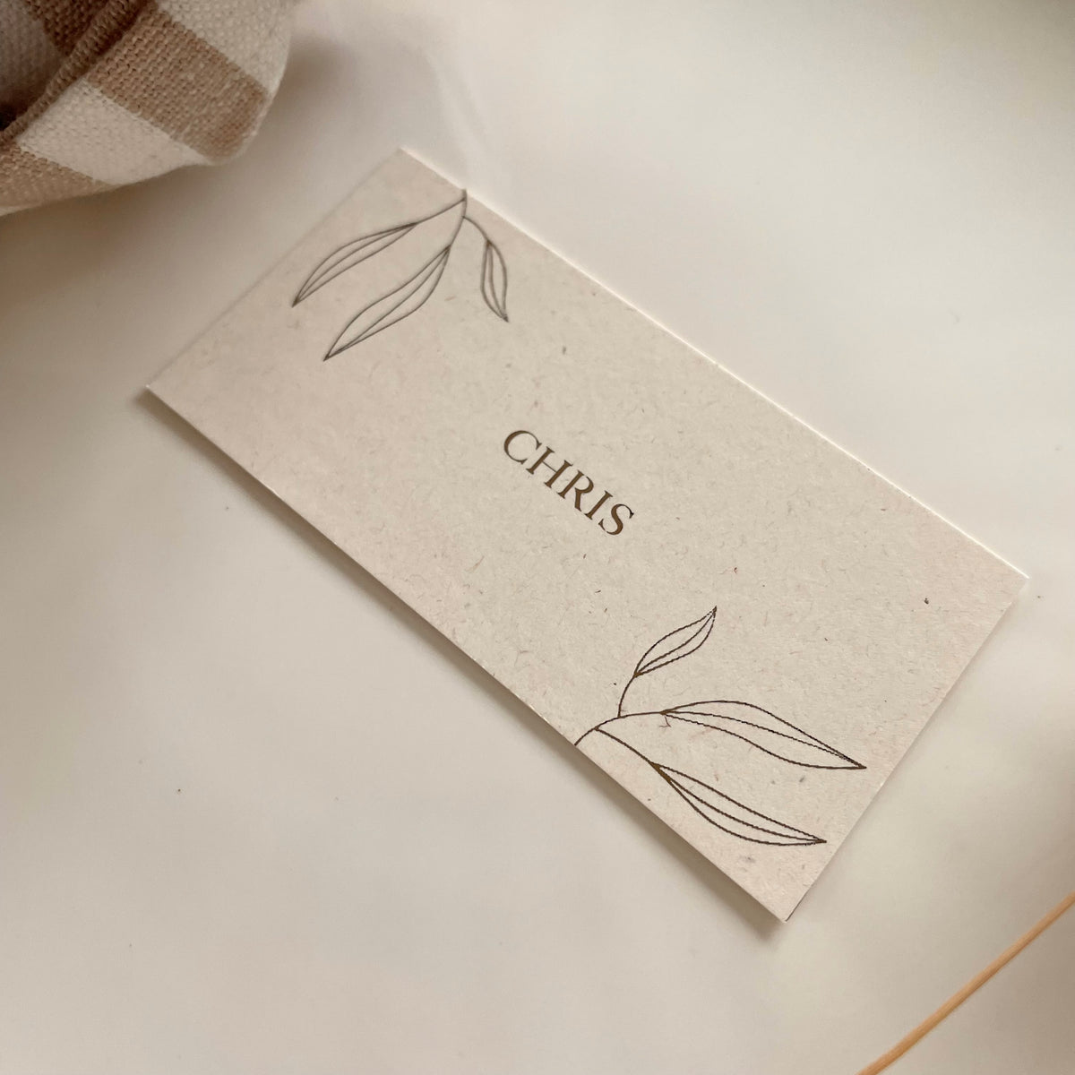 cream and gold foil place cards with leaf design