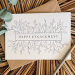 happy engagement card in black foil text on recycled card with a brown envelope