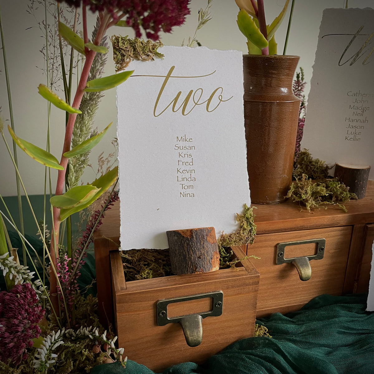 Woodland moss individual table plan cards with gold foil and rustic torn edges