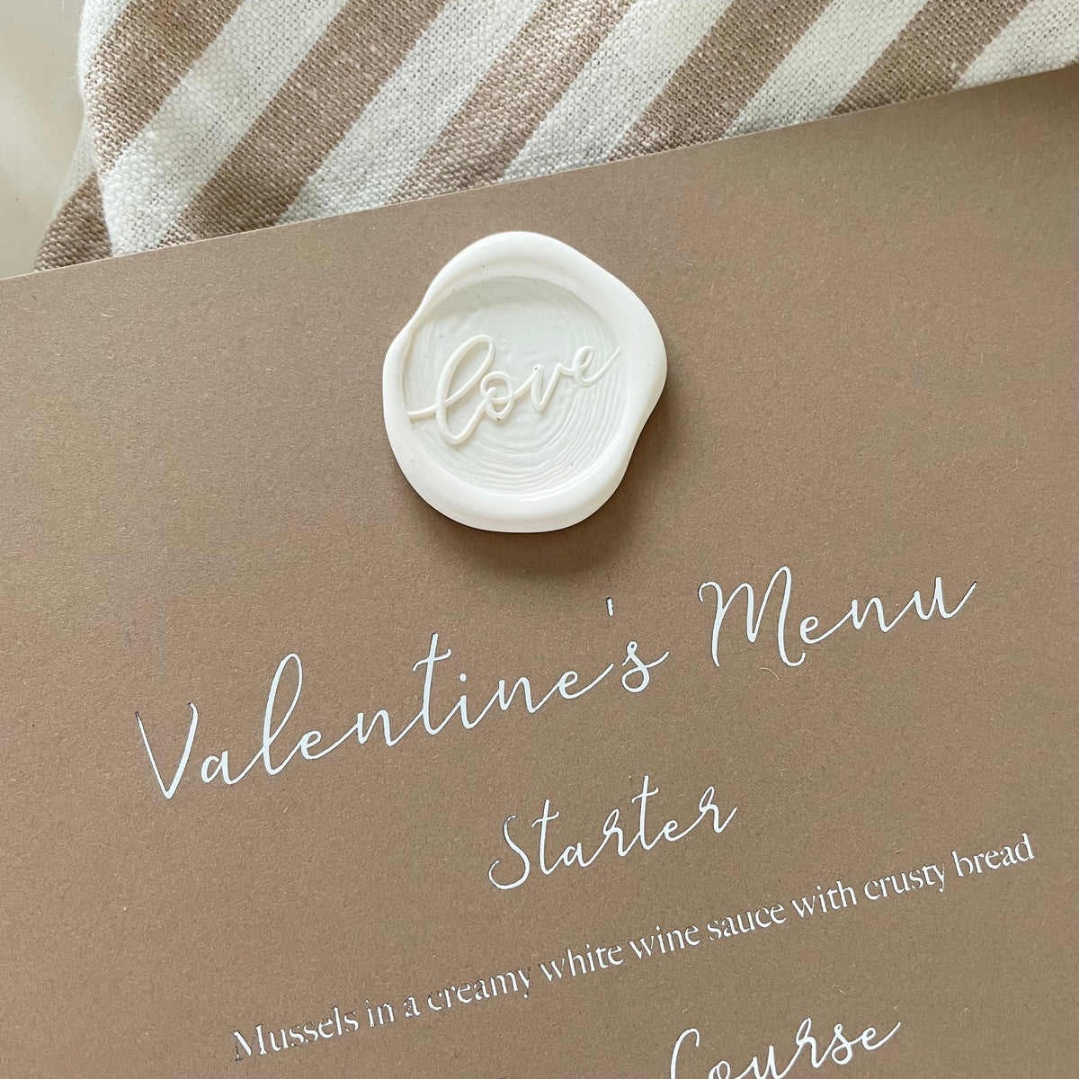 square valentines day menu card  with white wax seal for neutral tablescape