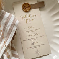 cream and gold valentines menu card with name tag and wax seal