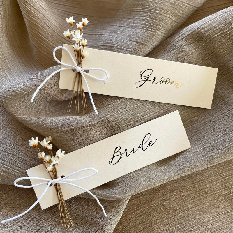 gold foil name tags with dried flowers