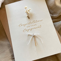 ivory and gold foil with dried flower engagement card for happy couple