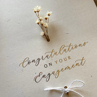 engagement card for happy couple ivory and gold foil with dried florals