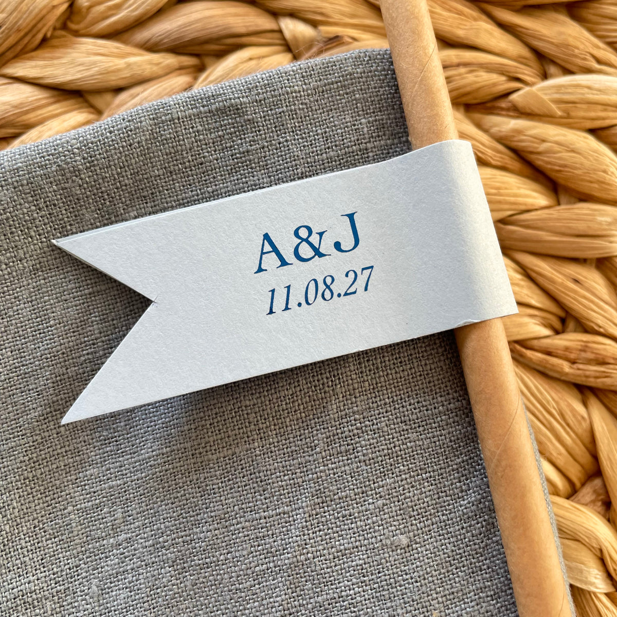 cheers to love brown paper straws with light blue card and blue foil personalised with couples initials and date for wedding day, engagement party or anniversary celebration