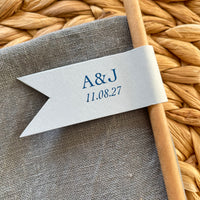 cheers to love brown paper straws with light blue card and blue foil personalised with couples initials and date for wedding day, engagement party or anniversary celebration
