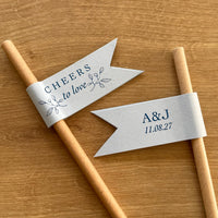cheers to love brown paper straws with light blue card and blue foil personalised with couples initials and date for wedding day, engagement party or anniversary celebration