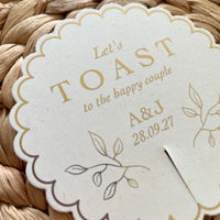 let toast to the happy couple cream and gold drink tag scallop circle