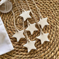 white clay star christmas napkin holders