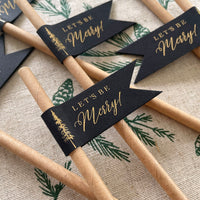 christmas tree paper straws with let's be merry text in gold foil