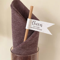 cheers to the newlyweds brown paper straws for wedding drinks made from recycled fleck card and bronze foil text. personalise the back with couples titles, married name and wedding date.
