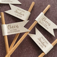 paper drink straw with recycled card and bronze foil with cheers to the newlyweds on the front of the flag, customisable on the back of the flag with married name, titles and wedding date