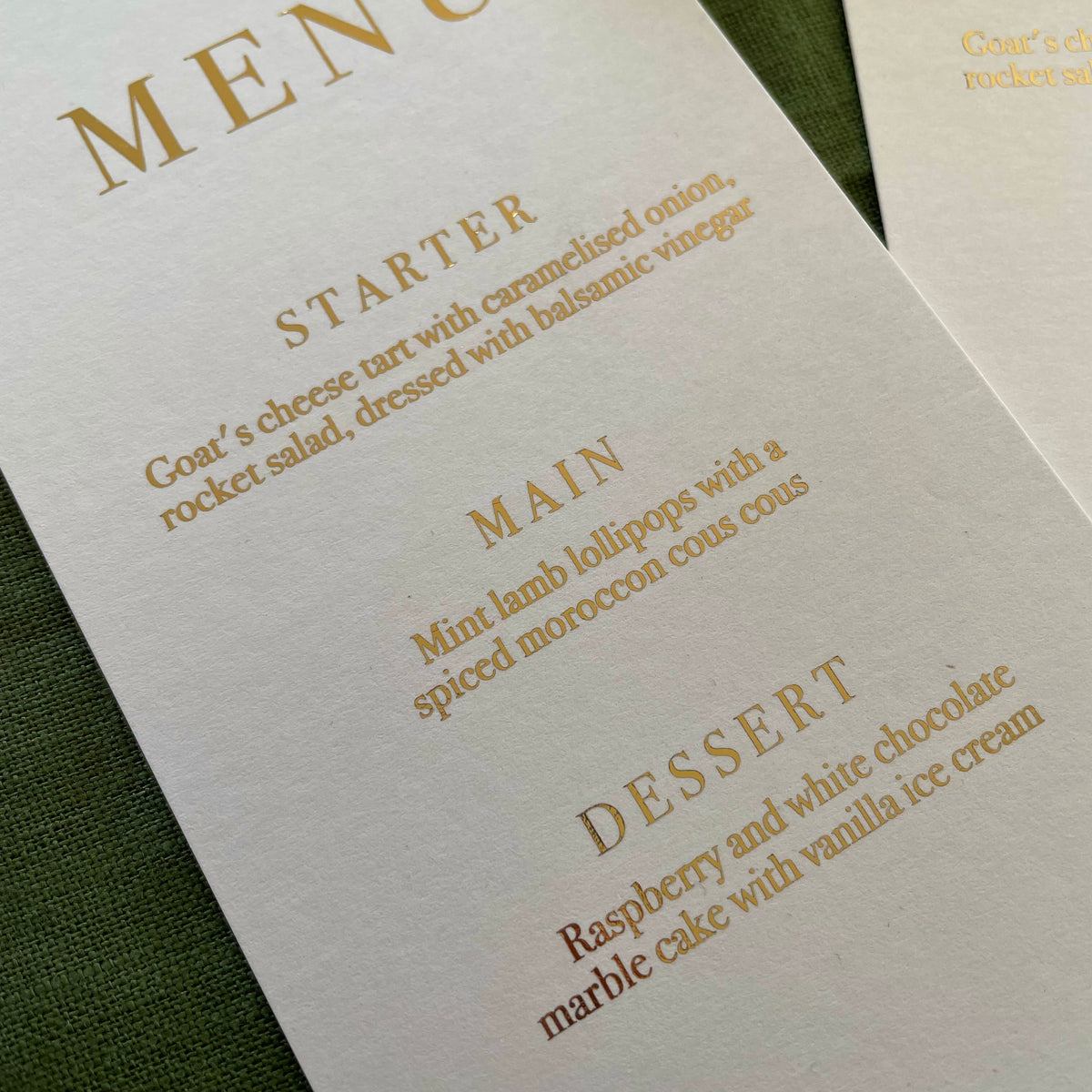 white card and gold foil text menu card for place settings