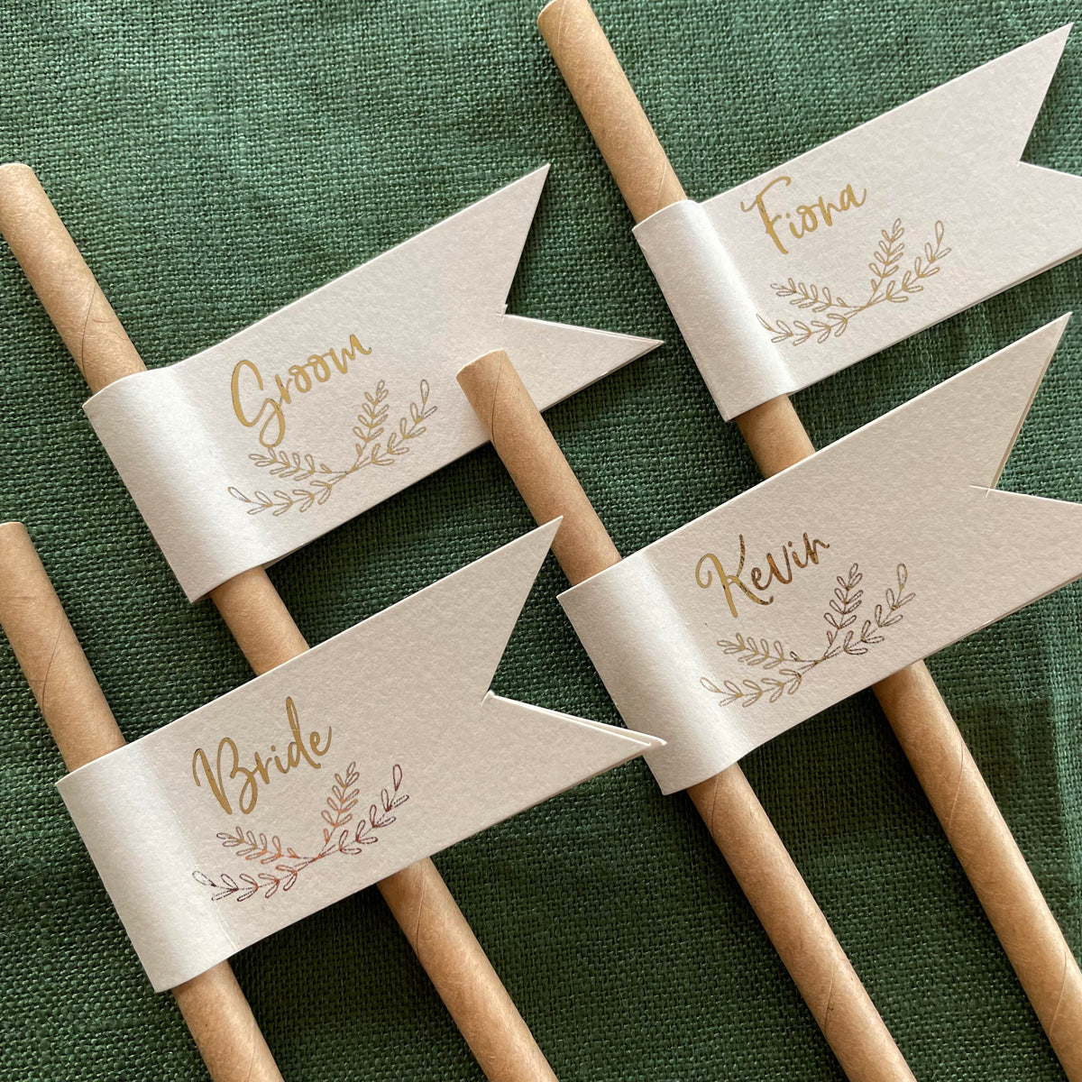 brown paper drink straws with cream card and gold foil with guests names for place settings