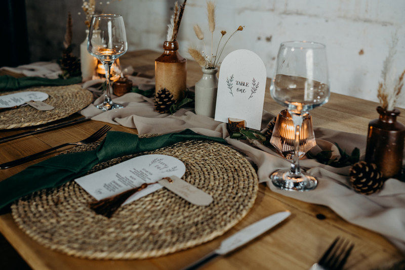 romantic wedding tablescape with neutral colours and stoneware bottles