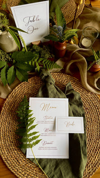 elegant white and gold wedding table stationery