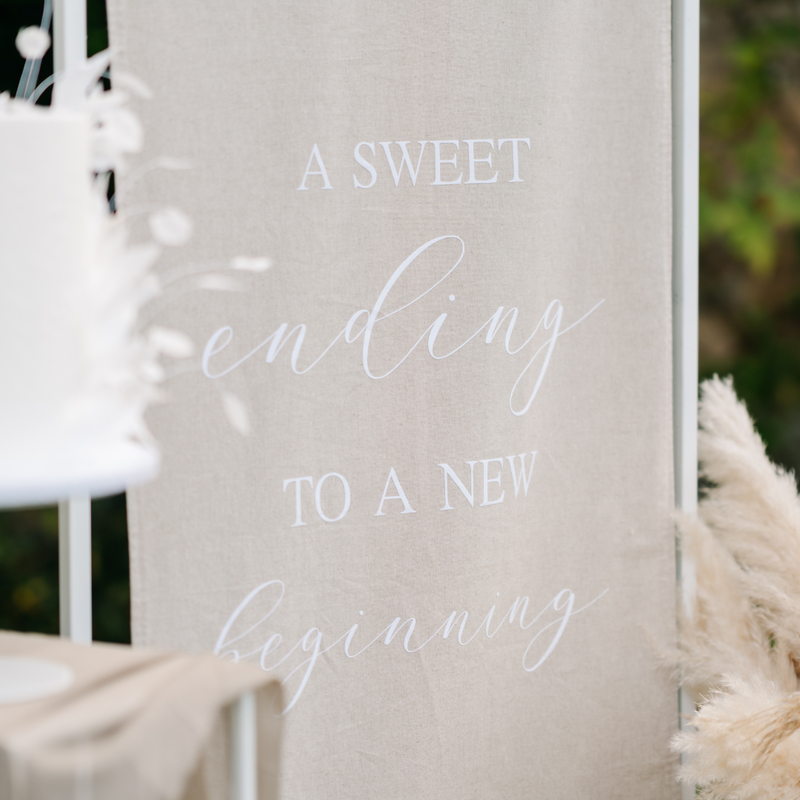 neutral wedding signage linen fabric and white writing