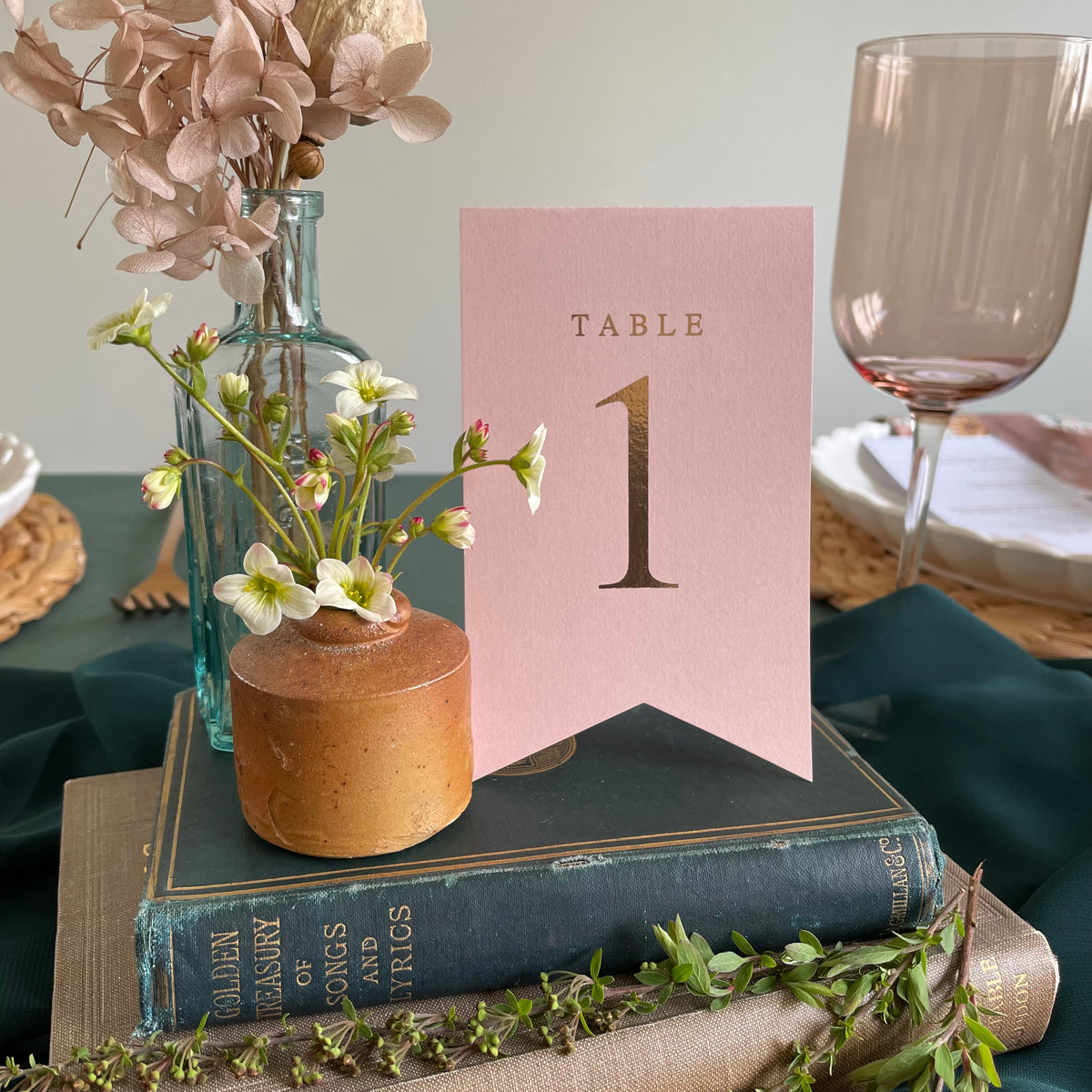 flag style folded table numbers blush pink and rose gold foil
