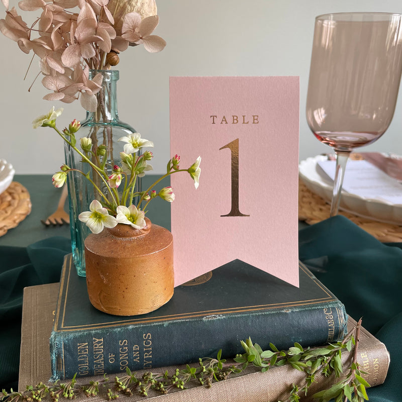 flag style folded table numbers blush pink and rose gold foil