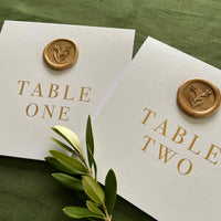 wax seal table numbers for gold and white wedding tables 