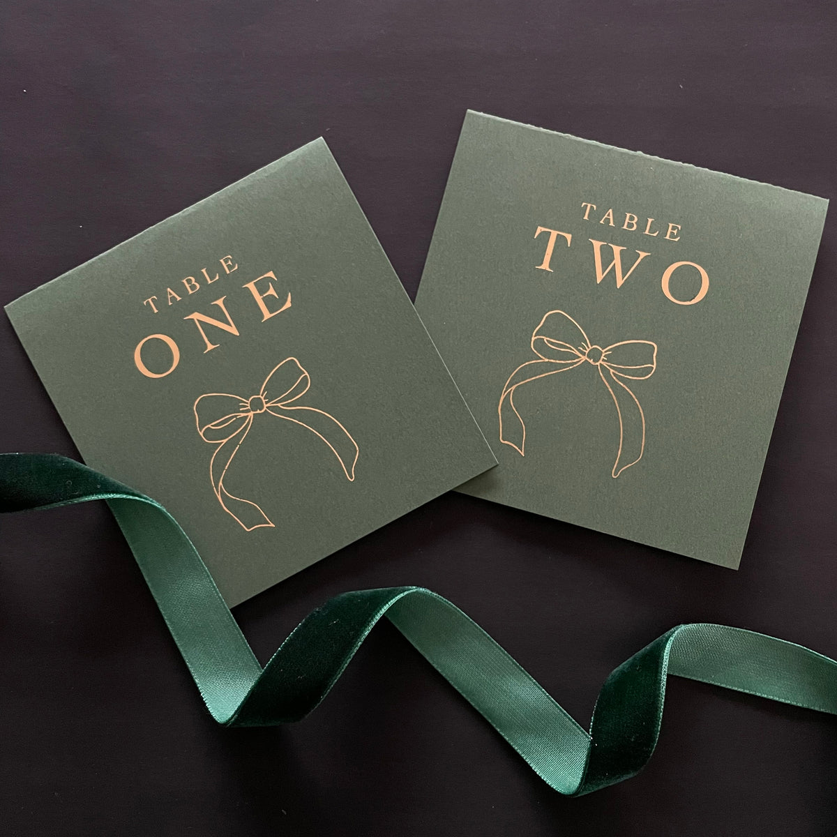 forest green and gold folded table numbers