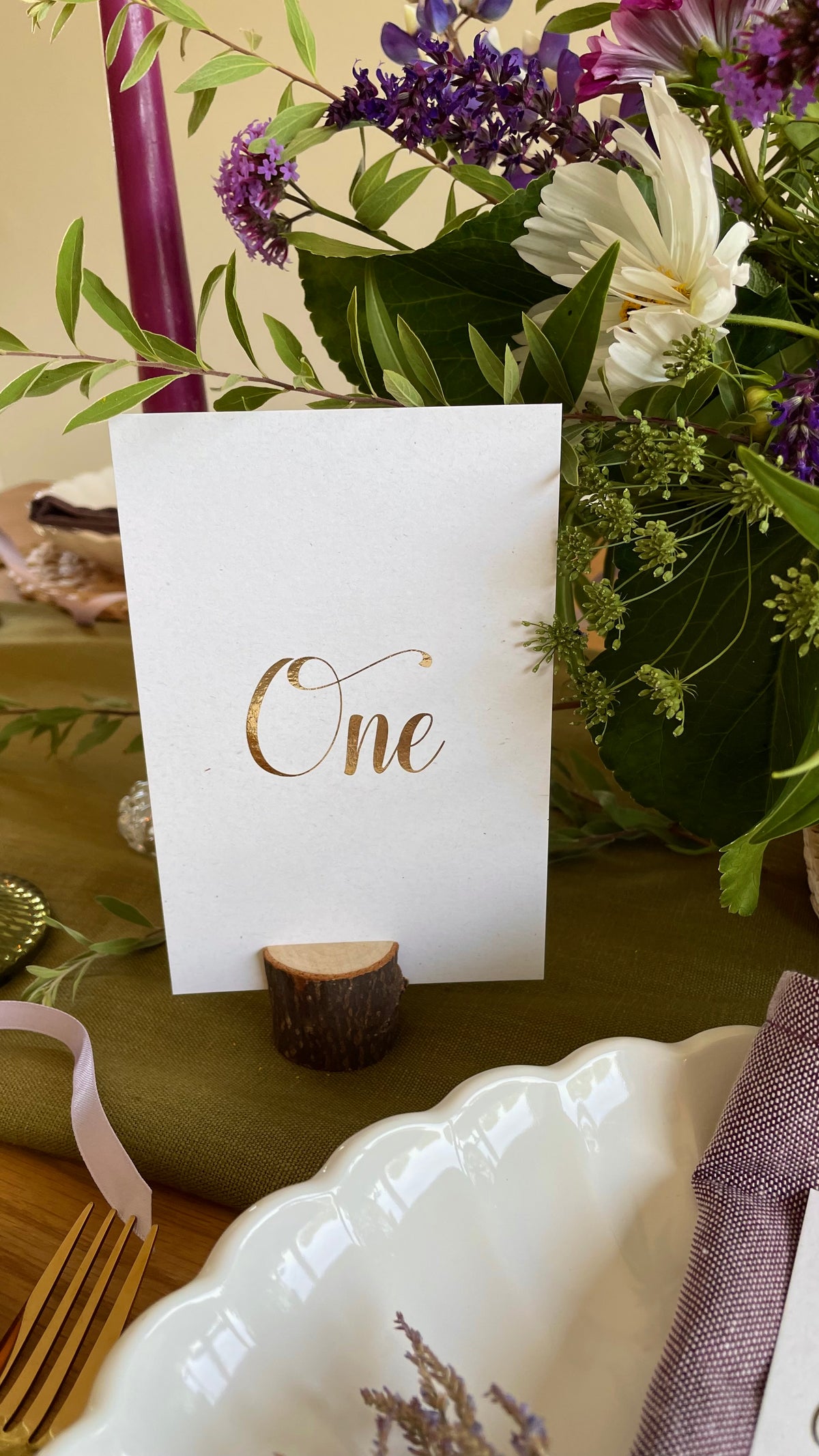table numbers for elegant wedding on recycled card in foil cursive text.