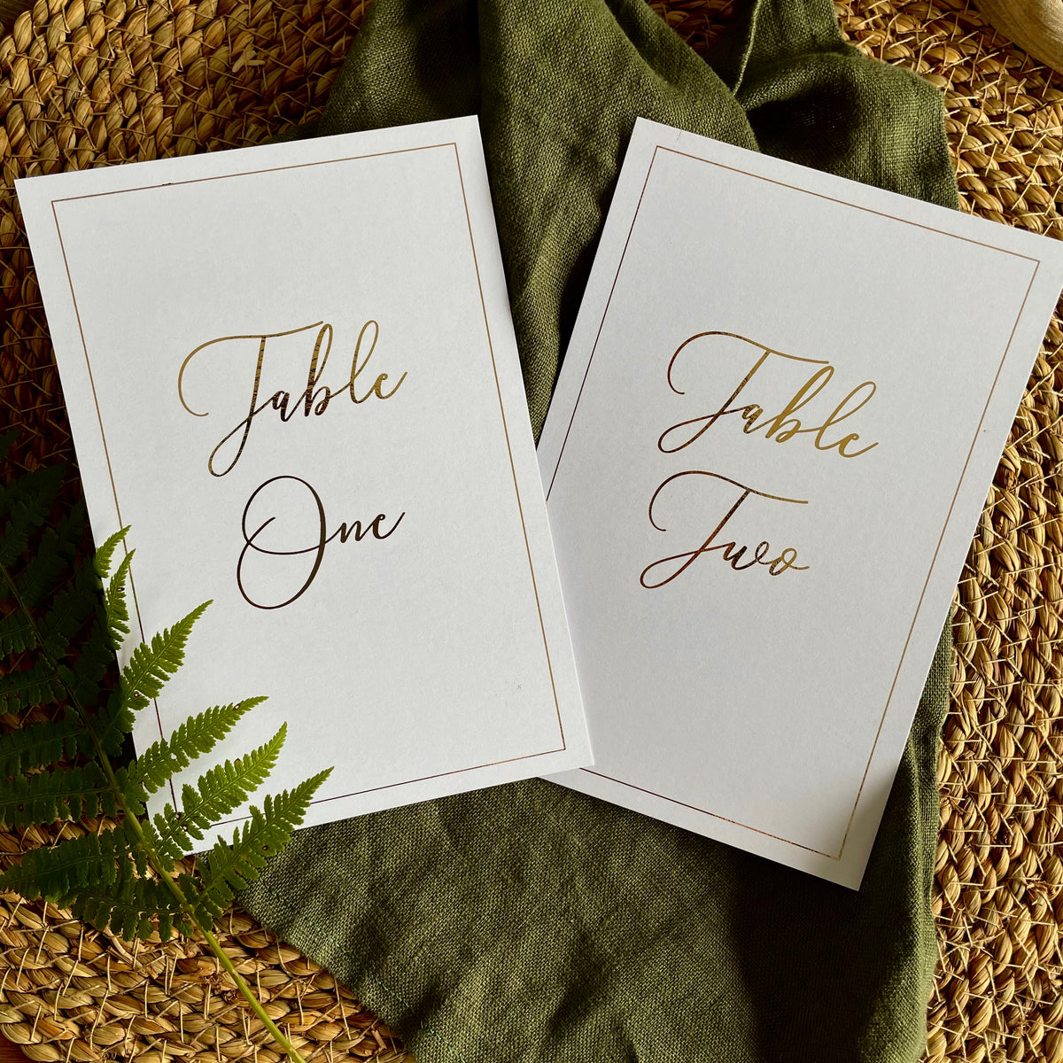 white and gold foil table numbers for rustic wedding reception