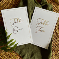 white and gold foil table numbers for rustic wedding reception