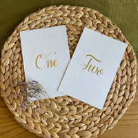 recycled table number cards for wedding tables with foiled script font