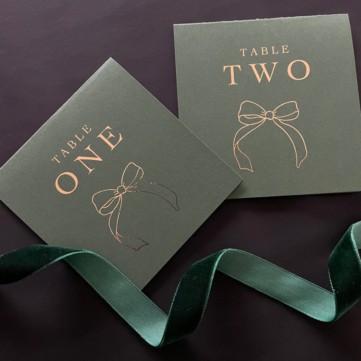 dark green and gold tented table number cards for wedding reception