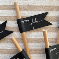 brown paper straws with black and white flag for halloween