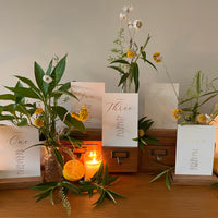 ivory and gold foil individual table plan cards for wedding recption