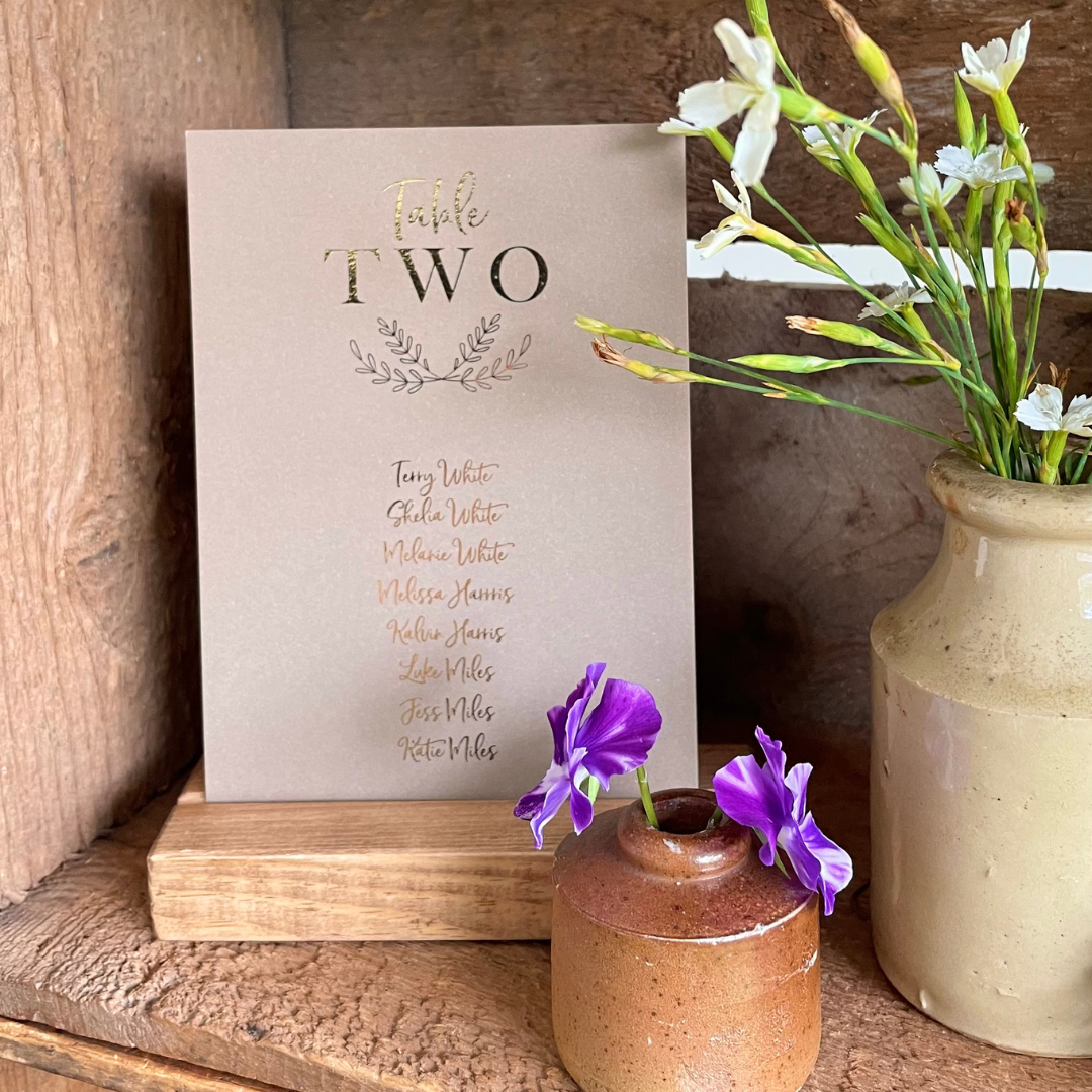 individual brown and gold foil seating plan cards for wedding reception