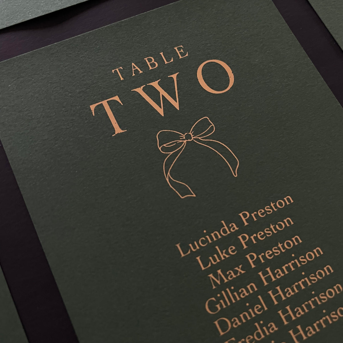 gold foil and dark green individual seating chart cards  for wedding reception