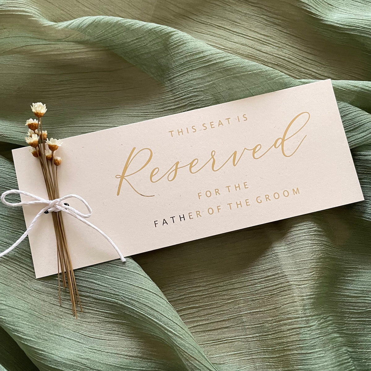 ivory and gold foil reserved cards for family members and wedding party