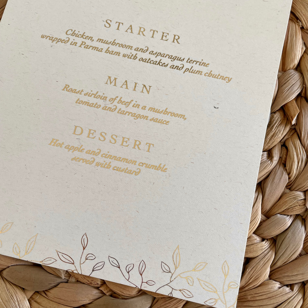 gold foil and ivory card wedding menu with leaf design