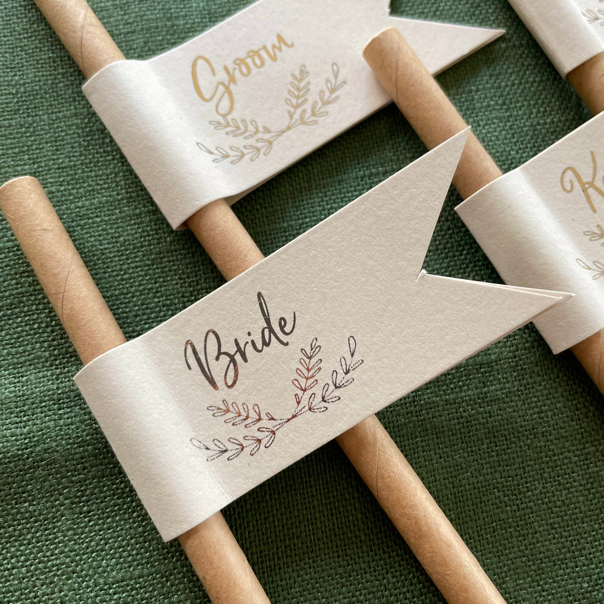 straw flags with guests names for rustic wedding table setting