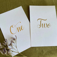 portrait wedding table numbers on recycled card and gold foil text