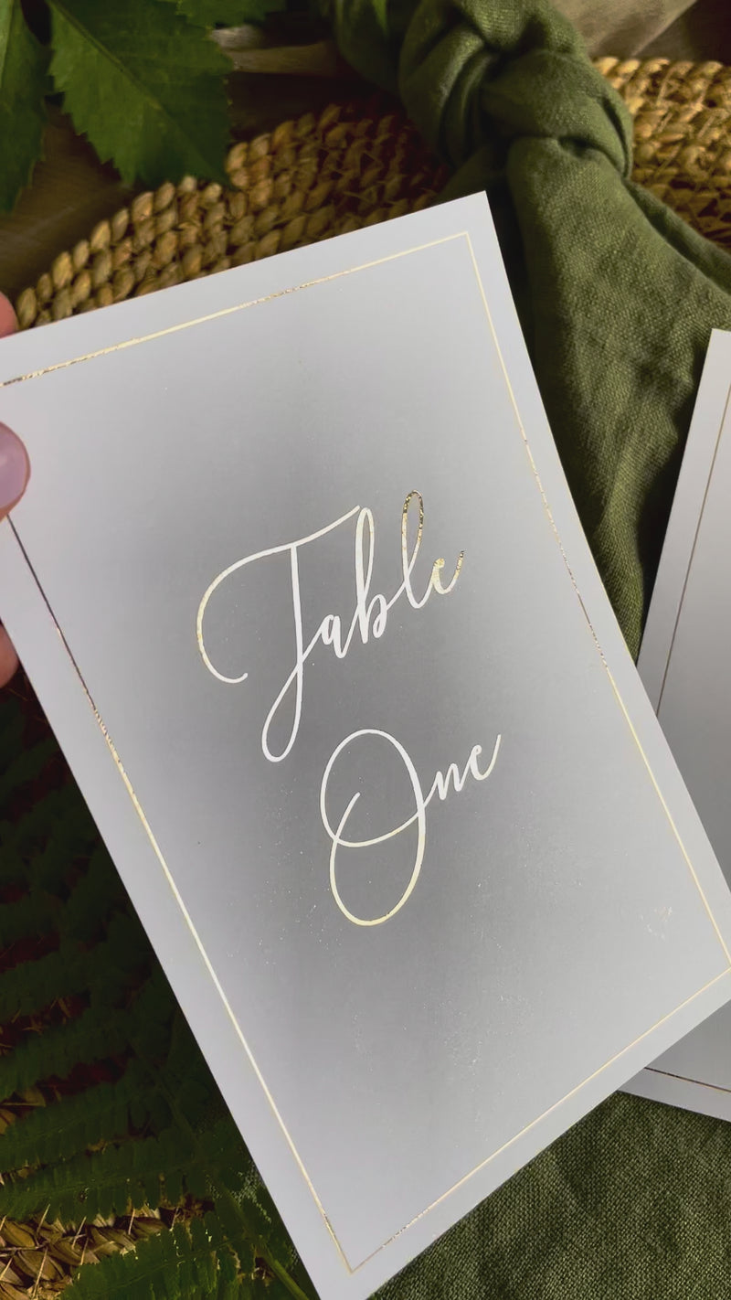 portrait wedding table numbers in gold foil with elegant font and thin border