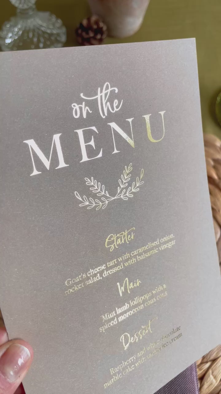 menu card in gold foil on brown card for rustic wedding reception