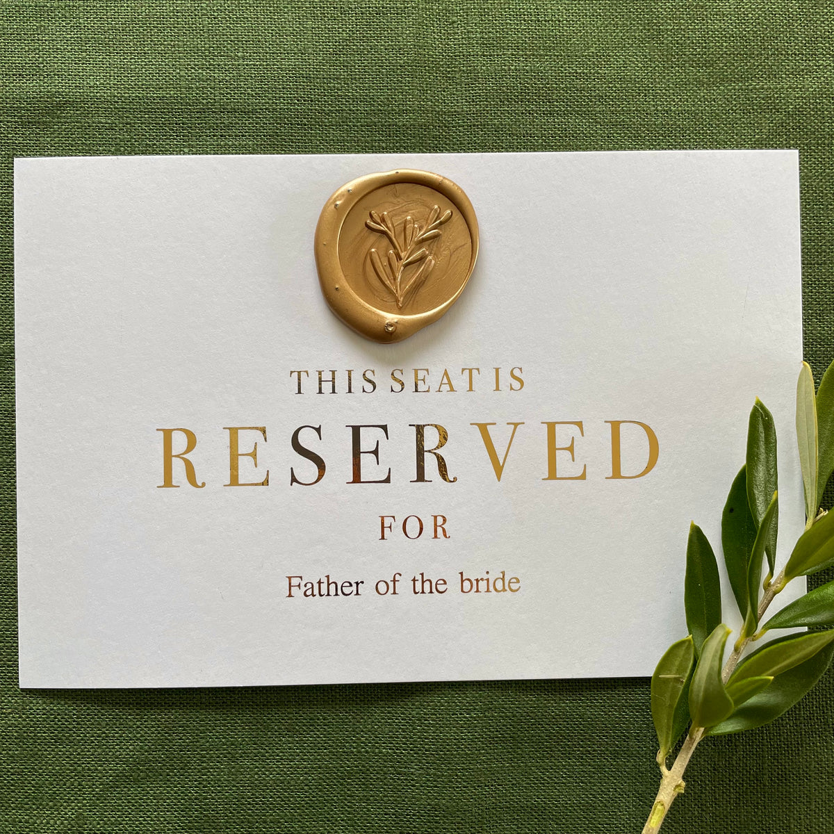 wax seal reserved cards for ceremony chairs on white card and gold foil