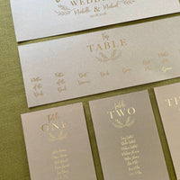 gold foil and brown card table plan cards