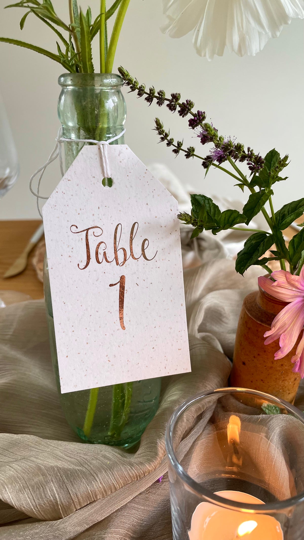 Luggage tag table numbers for wedding reception tables