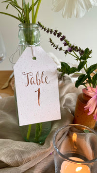 Luggage tag table numbers for wedding reception tables