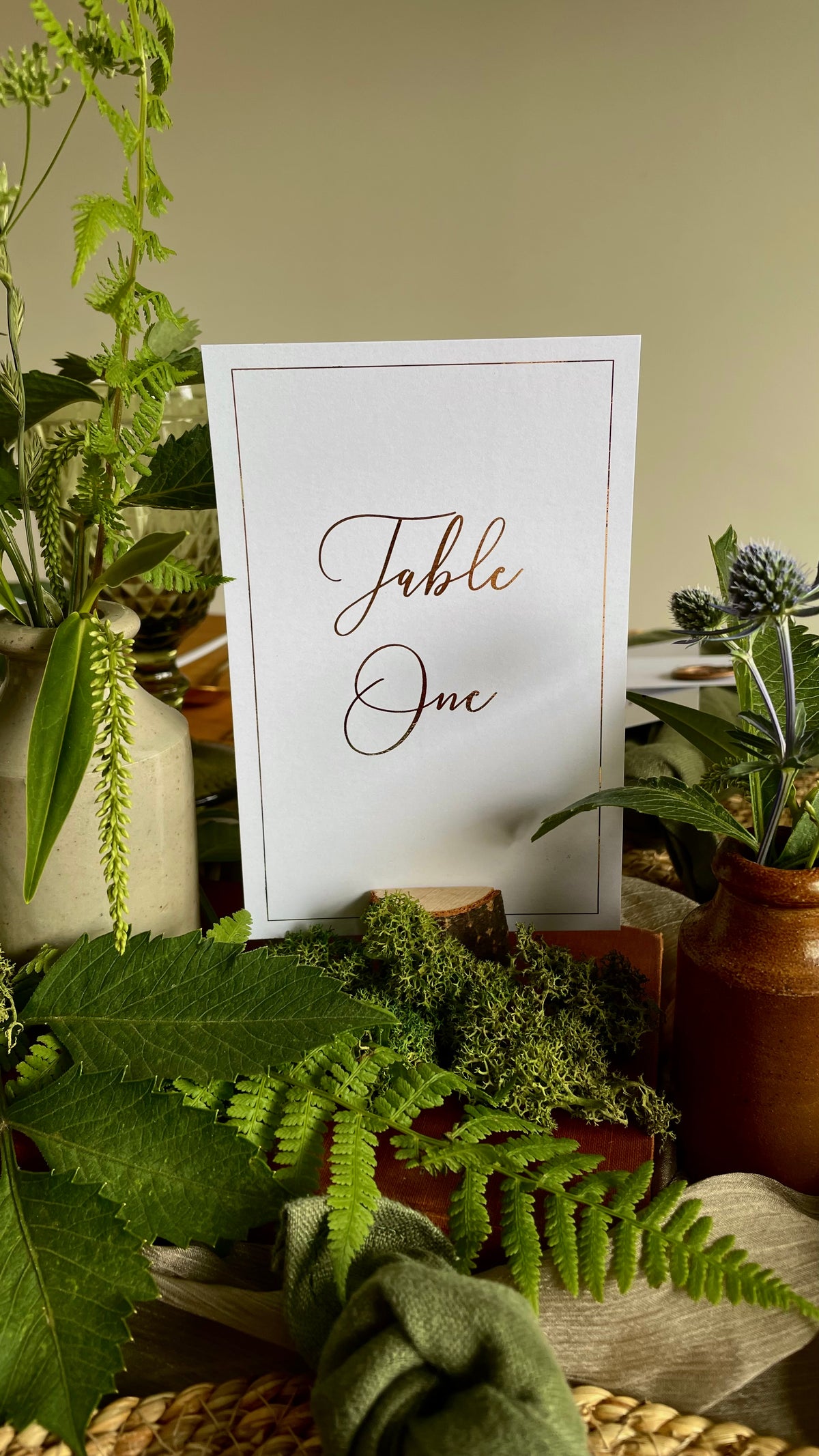 white table number sign for elegant wedding reception in gold foil text with gold foil border