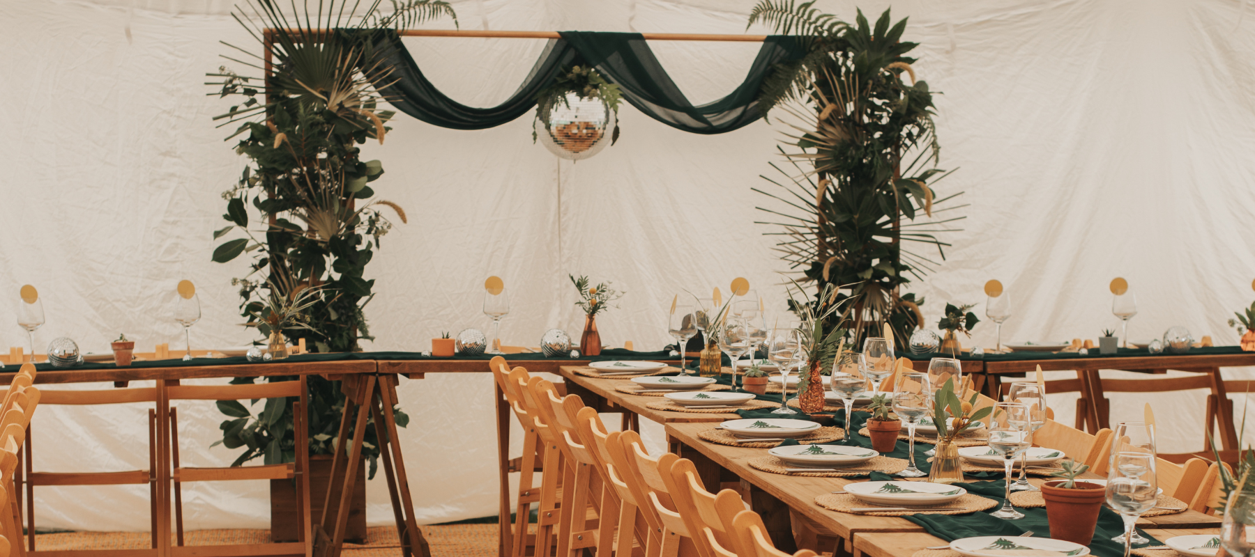 tropical leaves wedding backdrop with colourful tablescape