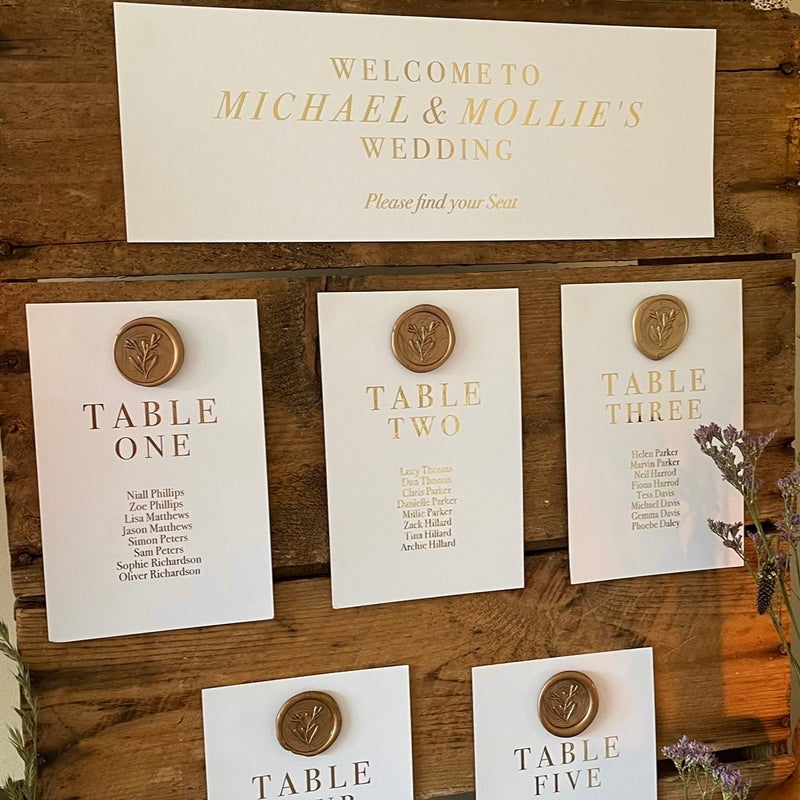 wedding table arrangement cards in gold