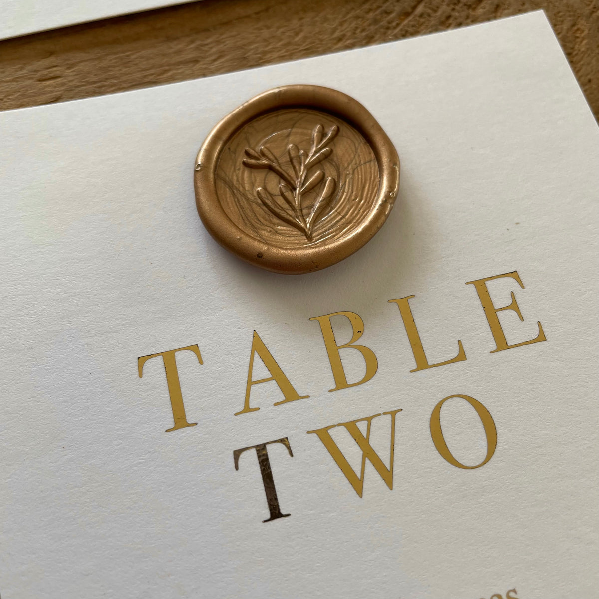 wax seal table plan with gold foil