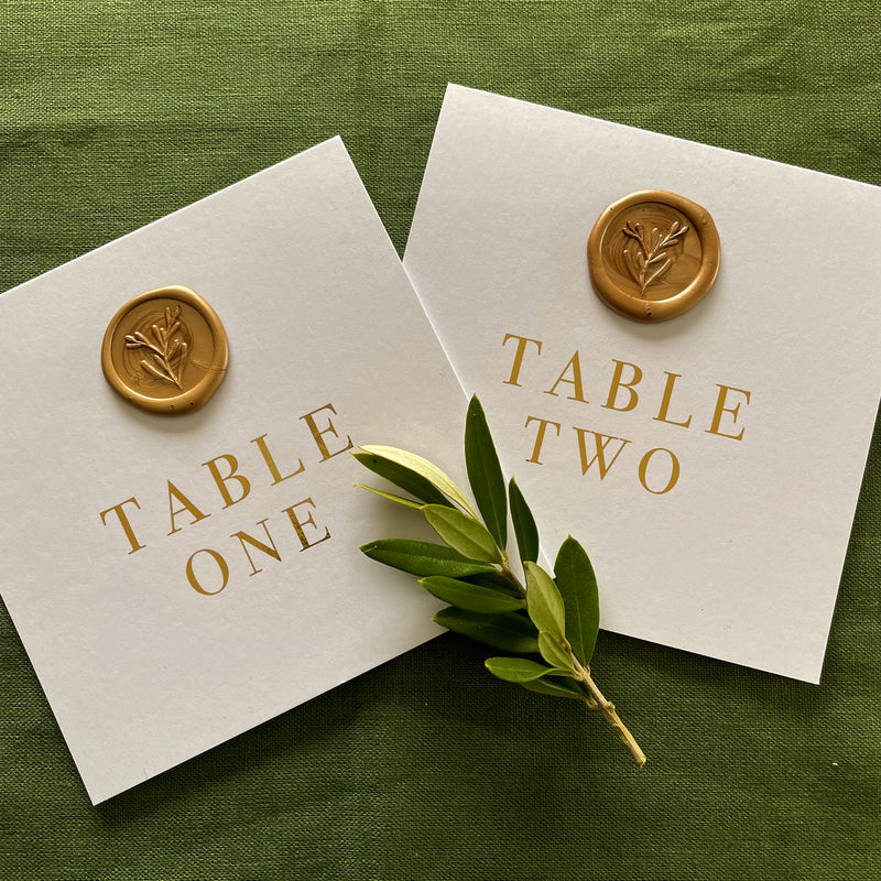 stand up wedding table numbers on white card gold foil with gold wax seal