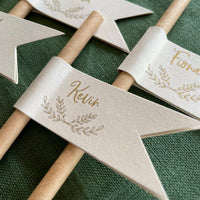 brown paper drink straws with cream and gold foil guests names for place settings for rustic outdoor wedding